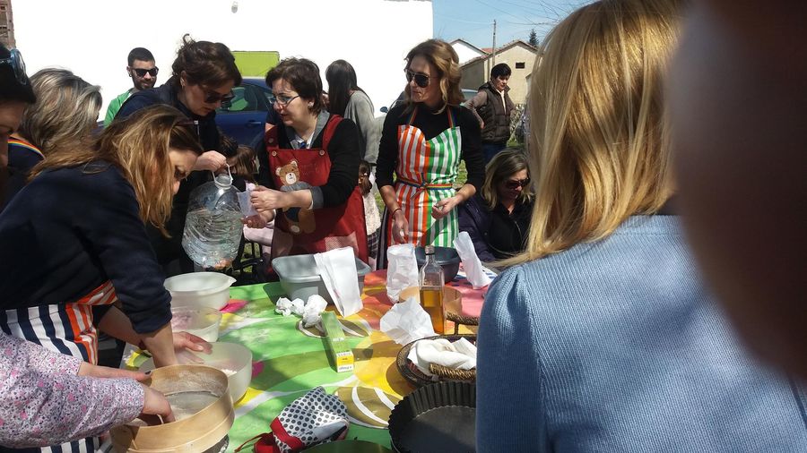woman teaching cooking lessons to tourists at 'The Trinity Farm'